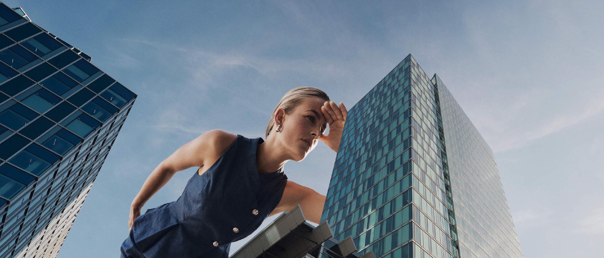 Woman towering over the WTC Amsterdam offices on the Zuidas