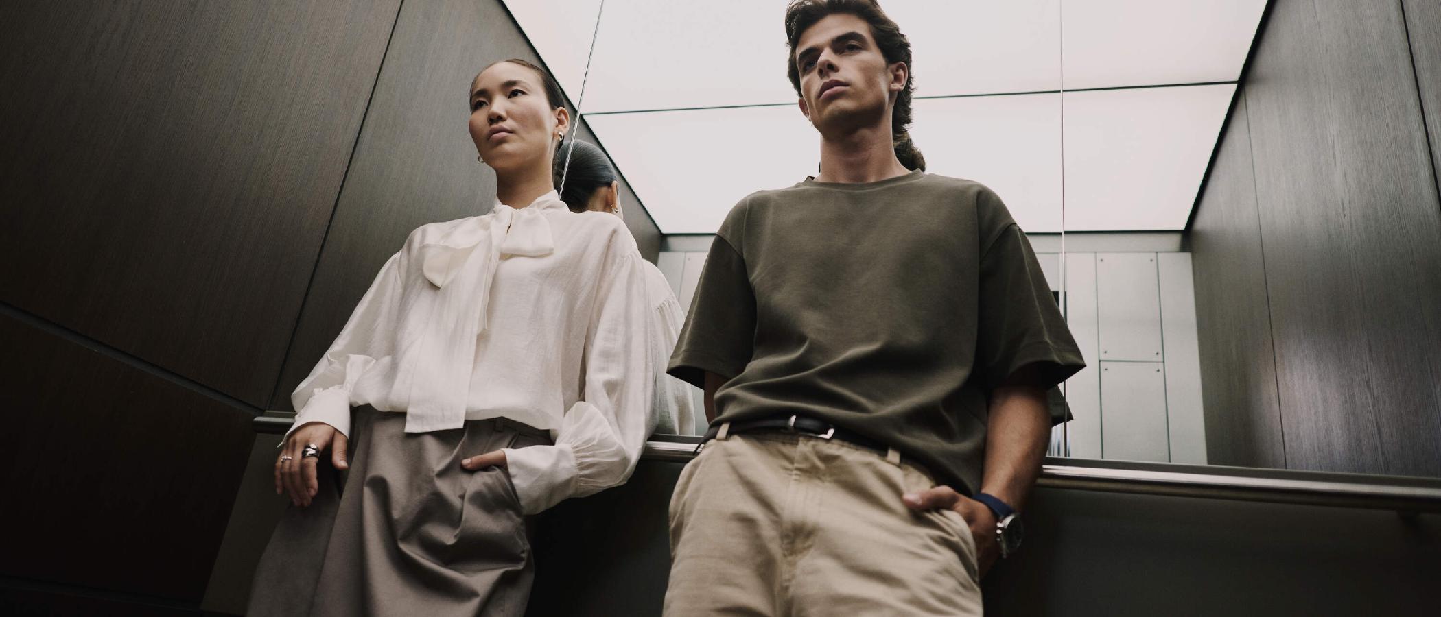 Two people sharing an elevator at WTC Amsterdam