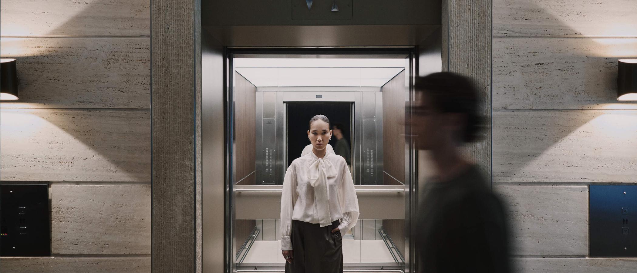 Woman waiting in an elevator at WTC Amsterdam