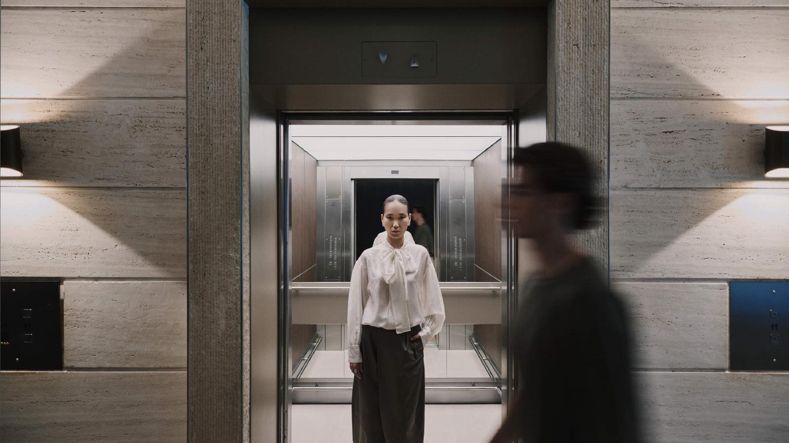 Woman waiting in an elevator at WTC Amsterdam